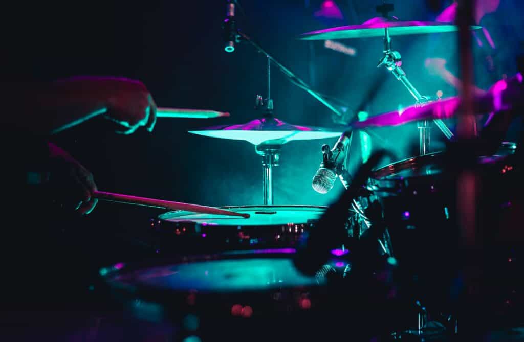 man playing drum set on stage