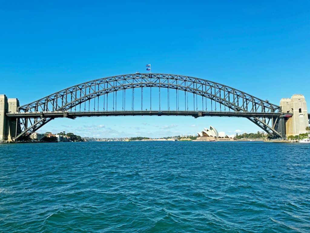 white bridge over the sea during daytime