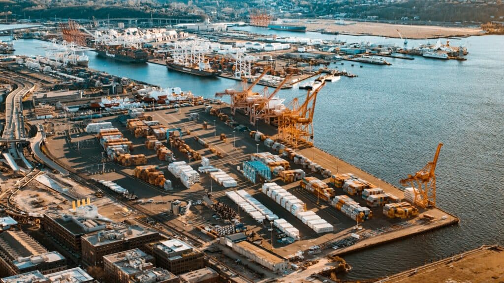 aerial view of city buildings near body of water during daytime